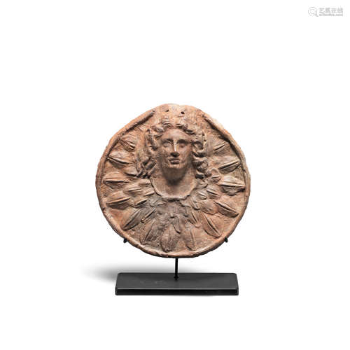 A South Italian terracotta roundel with head of Alexander Gorgoneion