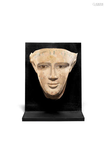 An Egyptian painted stucco mummy mask of a young man