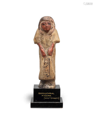 An Egyptian polychrome glazed composition shabti for Hem-Hotep