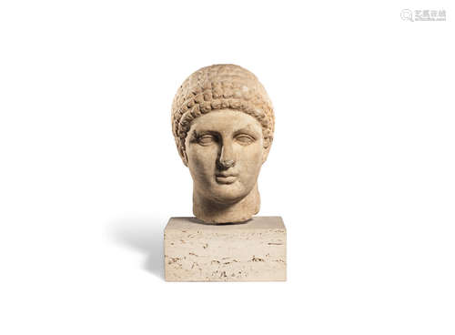 A Roman marble Archaistic head of a youthful male