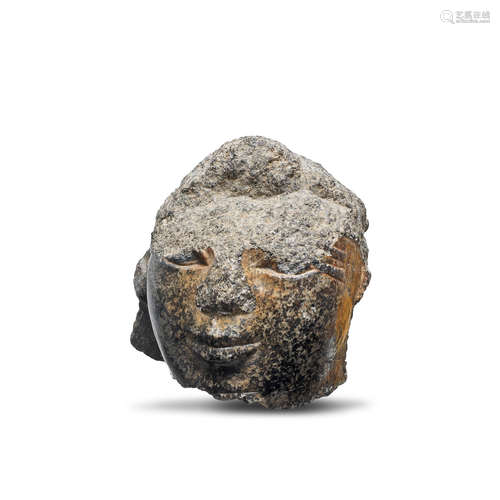 An Egyptian granite fragmentary head of a male