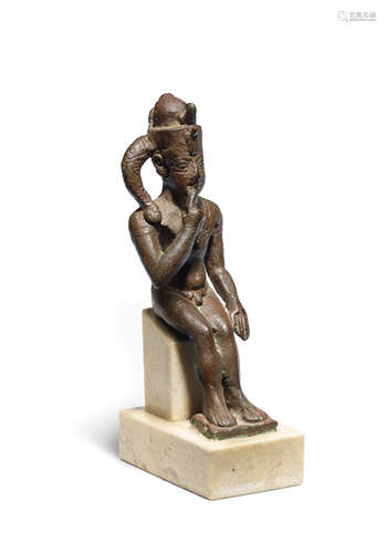 An Egyptian bronze figure of Harpocrates