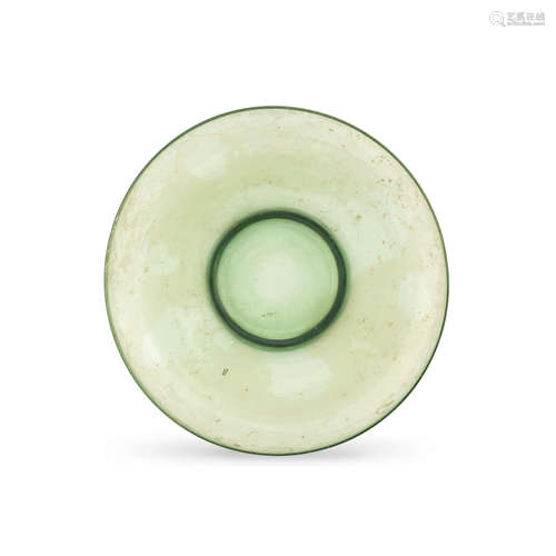 A Roman green glass dish