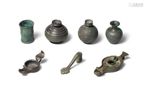 Three Roman bronze vessels, two Roman oil lamps and a Roman bronze handle