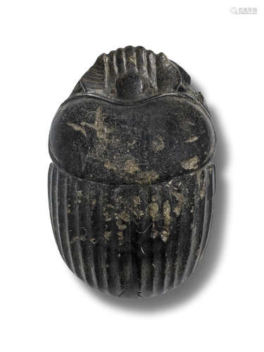 An Egyptian green basalt heart scarab