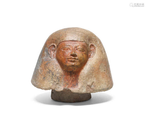 An Egyptian terracotta canopic jar lid