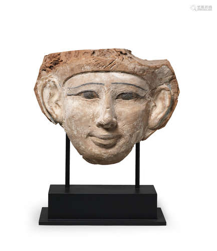 An Egyptian wood sarcophagus mask