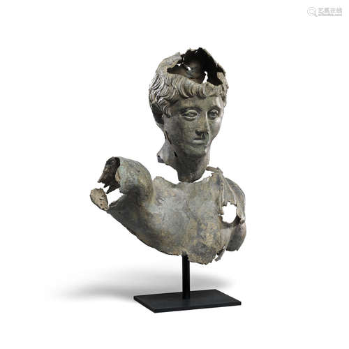 A Roman bronze fragmentary bust of a young man