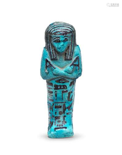 An Egyptian turquoise glazed composition shabti for Amenemipt