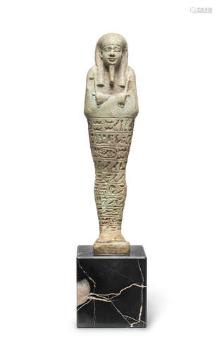 An Egyptian turquoise glazed composition shabti for the  Overseer of the Royal Fleet, Psamtek-mery-Ptah