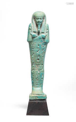 An Egyptian light blue glazed composition shabti for Wedja-Hor