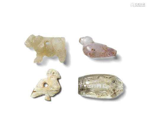 Four Near Eastern hardstone and shell amulets  4