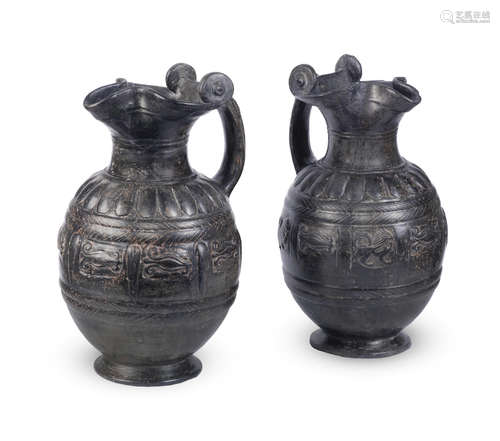 Two Etruscan bucchero ware trefoil-lipped oinochoai  2