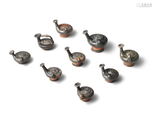 A group of eight Campanian black-glazed gutti  8