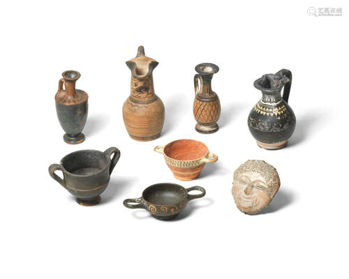 Seven miniature Greek pottery vessels and a Campanian terracotta gorgon mask  8