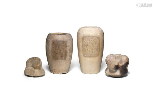 Two Egyptian limestone canopic jars and two Egyptian canopic jar lids of Hapy  4