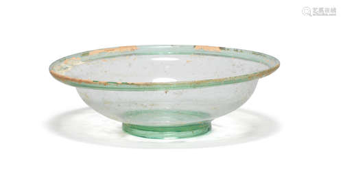 A large Roman green glass dish