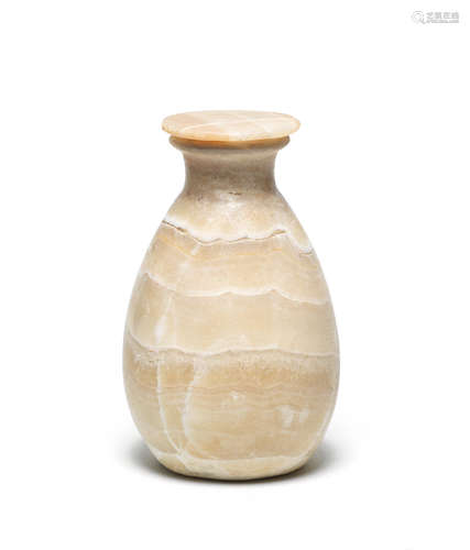 An Egyptian alabaster jar and alabaster lid