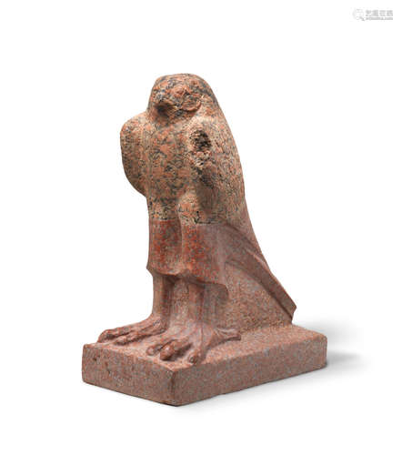 An Egyptian fragmentary pink granite Horus falcon