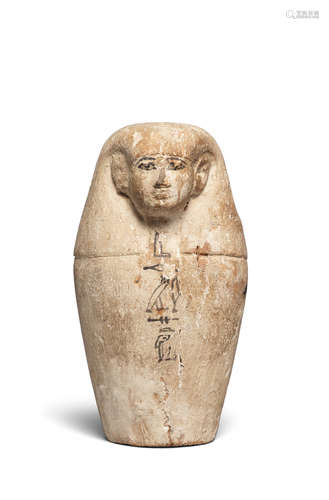 An Egyptian wood dummy canopic jar