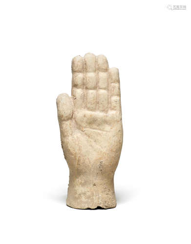 An Etruscan terracotta votive hand