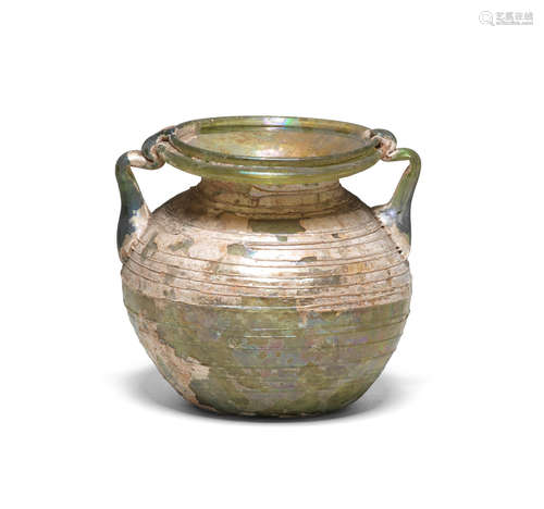 A large Roman green glass two-handled jar