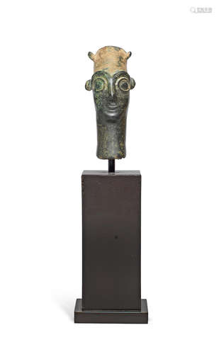 A Hittite bronze head of a god