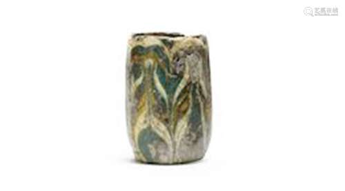 An Egyptian fragmentary core-formed glass vessel