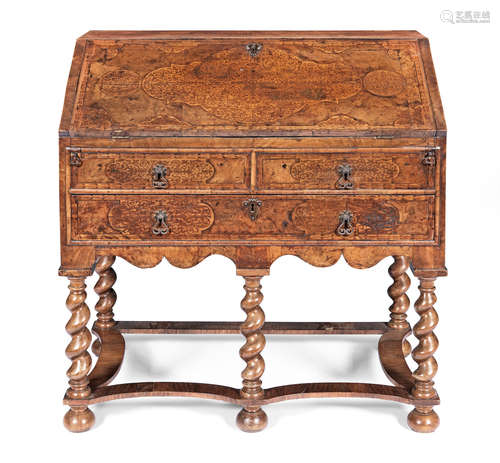 A William and Mary walnut and seaweed marquetry bureau on a later stand