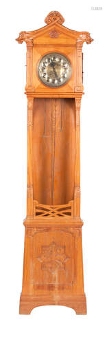 A late 19th century Art Nouveau style oak long case clock