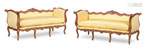 A pair of 19th century style carved giltwood and gesso sofas, 20th century