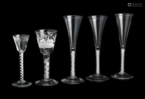 Circa 1750-60 A set of three opaque-twist wine flutes, a small wine or cordial glass and an airtwist glass