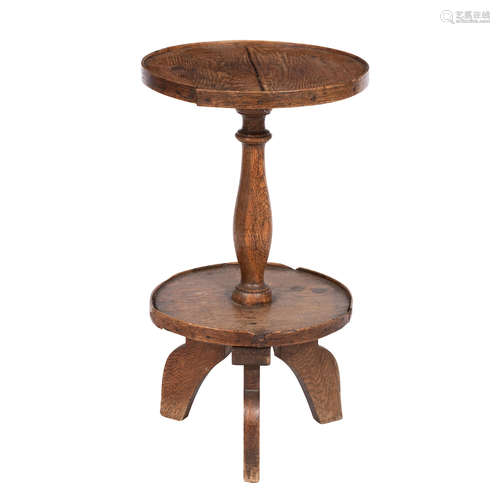 An 18th century and later two tier oak lampstand