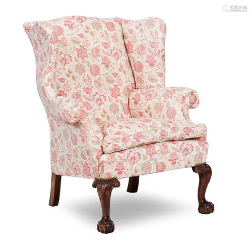 A George III style mahogany wing back arm chair, 19th century and later