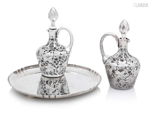 the salver by Asprey, London 1936, the decanters unmarked  A silver salver and a pair of decanters