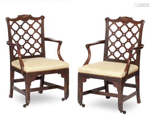 A pair of mahogany Chippendale-style carved open armchairs 20th century