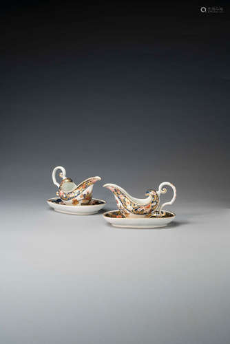 A very rare pair of Meissen Imari sauceboats and oval stands, circa 1740