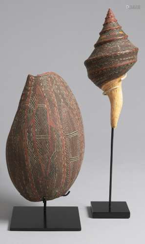 A pair of painted shells, 1960s 34.0cm (13 3/8in).; 34.5cm (13 9/16in). Dick Nangabarra(born 1931-?)