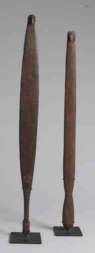 A pair of spearthrowers, eastern Kimberley region, Western Australia and eastern Cape York, Queensland heights: 87.0cm and 81.0cm (34 1/4 and 31 7/8in). Maker Unknown