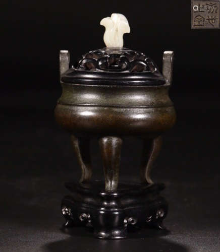 A COPPER THREE-LEGGED CENSER