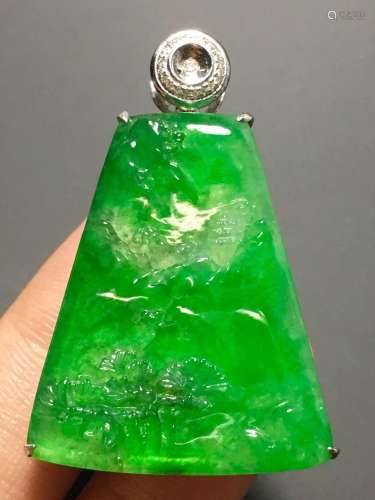 A GREEN JADEITE CARVED LANDSCAPE PENDANT