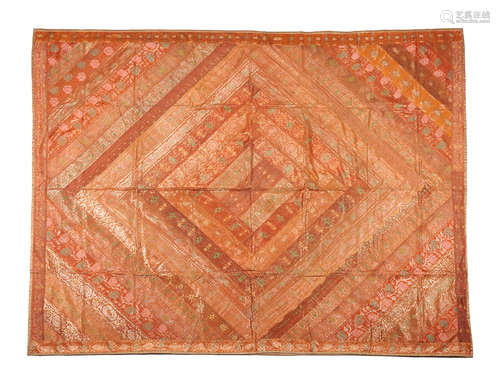 A fine pieced orange silk and metallic silver brocade coverlet