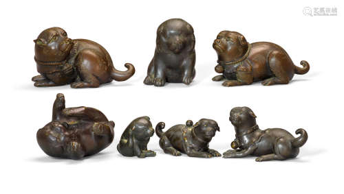 A group of seven bronze puppies, okimono   19th/20th century