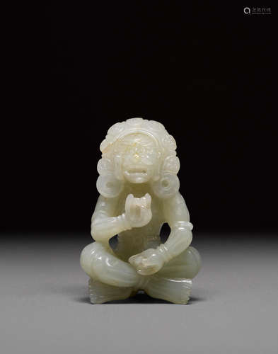 A jade carving of a seated figure