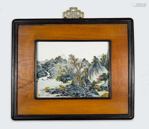 A polychrome enameled porcelain landscape plaque