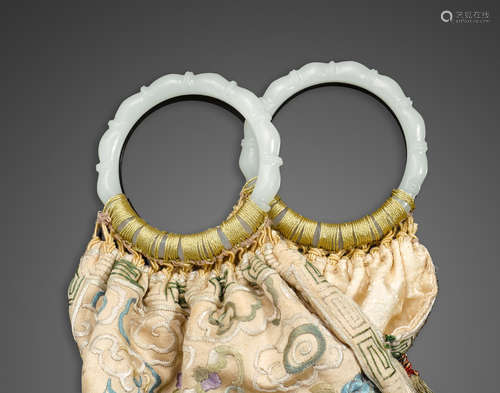 An embroidered silk purse with jade bangle handles