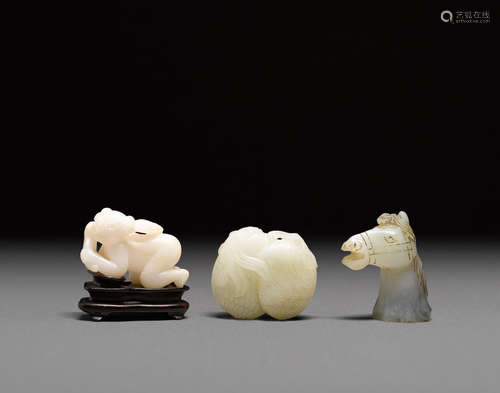 a group of three jade carvings