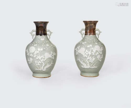 A pair of celadon glazed vases with white slip decoration  19th century
