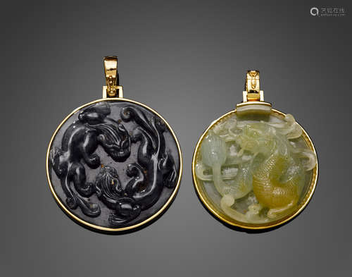 Two circular carved jade and 14k gold pendants