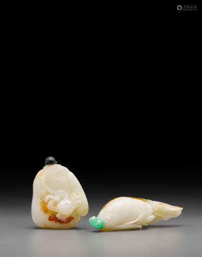 Two carved white jade snuff bottles